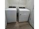 White Whirlpool washer and dryer in a spacious laundry room at 413 Trotters Ln, Moncks Corner, SC 29461