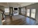 Spacious living room with hardwood floors, fireplace, and sliding glass doors at 413 Trotters Ln, Moncks Corner, SC 29461