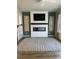 Living room with fireplace, wall-mounted TV, and access to backyard at 413 Trotters Ln, Moncks Corner, SC 29461