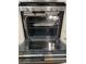 Stainless steel oven interior showcasing racks and trays for convenient baking and roasting at 413 Trotters Ln, Moncks Corner, SC 29461