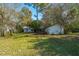 Overgrown backyard with two small structures needing renovation at 4230 Barnwell Ave, North Charleston, SC 29405