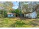 Overgrown backyard with two small structures needing renovation at 4230 Barnwell Ave, North Charleston, SC 29405