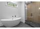 Bathroom with freestanding tub and walk-in shower at 5105 St George Ln, Hollywood, SC 29449