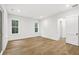 Spacious bedroom with hardwood floors and door to bathroom at 5105 St George Ln, Hollywood, SC 29449