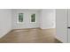 Bright bedroom with hardwood floors and windows at 5105 St George Ln, Hollywood, SC 29449
