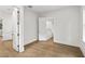 Light-filled hallway with hardwood floors and access to upper level at 5105 St George Ln, Hollywood, SC 29449