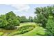 Serene landscape showcasing a golf course and waterfront views at 5105 St George Ln, Hollywood, SC 29449