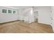 Spacious loft area with hardwood floors and white railing at 5105 St George Ln, Hollywood, SC 29449