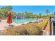 Community swimming pool with lounge chairs and umbrellas at 5105 St George Ln, Hollywood, SC 29449