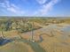 Aerial view of waterfront homes and marsh landscape at 6411 China Back Ln, Meggett, SC 29449