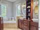 Spa-like bathroom with double vanities and a soaking tub at 6411 China Back Ln, Meggett, SC 29449