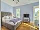 Spacious bedroom with hardwood floors and a view at 6411 China Back Ln, Meggett, SC 29449