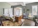 Bedroom with canopy bed, wooden chest, and tranquil view at 6411 China Back Ln, Meggett, SC 29449