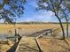 Long wooden boardwalk extends over marsh grasses toward the horizon at 6411 China Back Ln, Meggett, SC 29449