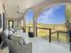 Relaxing covered porch with wicker furniture and stunning marsh views at 6411 China Back Ln, Meggett, SC 29449