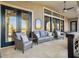 Spacious covered porch features comfortable seating and access to the home at 6411 China Back Ln, Meggett, SC 29449