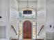 Bright entryway with an arched window and a wooden door at 6411 China Back Ln, Meggett, SC 29449