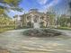Impressive home boasting a circular drive and lush landscaping at 6411 China Back Ln, Meggett, SC 29449