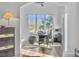 Bright home office features a large window, built-in desk, and hardwood floors at 6411 China Back Ln, Meggett, SC 29449