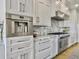 Modern kitchen features stainless steel appliances and marble counters at 6411 China Back Ln, Meggett, SC 29449