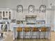 Modern kitchen with white cabinets, marble countertops, and island at 6411 China Back Ln, Meggett, SC 29449