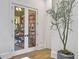 Home office with glass french doors and built-in bookshelves at 6411 China Back Ln, Meggett, SC 29449
