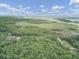 Aerial view of property with marsh views and wooded area at 820 Pineneedle Way, Charleston, SC 29492