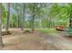 Wooded backyard with a picnic table and shed at 820 Pineneedle Way, Charleston, SC 29492