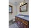 Bathroom with wood vanity, blue countertop and tiled floor at 820 Pineneedle Way, Charleston, SC 29492