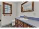 Bathroom with wood vanity, blue countertop and tiled floor at 820 Pineneedle Way, Charleston, SC 29492
