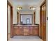 Bathroom with a double vanity and wooden cabinets at 820 Pineneedle Way, Charleston, SC 29492