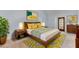 Mid-century modern bedroom with wood furniture and rug at 820 Pineneedle Way, Charleston, SC 29492