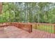 Wooden deck with view of a wooded area and grassy backyard at 820 Pineneedle Way, Charleston, SC 29492