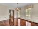 Spacious dining room featuring hardwood floors and chandelier at 820 Pineneedle Way, Charleston, SC 29492