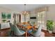 Bright dining room with hardwood floors and large windows at 820 Pineneedle Way, Charleston, SC 29492