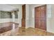 Entryway with wood door, stone floor and built-in cabinet at 820 Pineneedle Way, Charleston, SC 29492