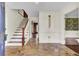Elegant entryway with stone flooring and wooden staircase at 820 Pineneedle Way, Charleston, SC 29492