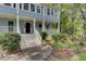 Two story house with wrap around porch and mature landscaping at 820 Pineneedle Way, Charleston, SC 29492