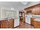 Galley kitchen with wood cabinets and white appliances at 820 Pineneedle Way, Charleston, SC 29492