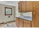 Laundry room with wooden cabinets and a light blue countertop at 820 Pineneedle Way, Charleston, SC 29492