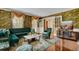 Charming living room with green sofas and floral wallpaper at 820 Pineneedle Way, Charleston, SC 29492