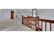 Loft with wooden railing overlooking the lower level at 820 Pineneedle Way, Charleston, SC 29492