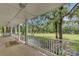 Spacious porch overlooking a tranquil backyard and pond at 820 Pineneedle Way, Charleston, SC 29492