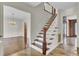 Wooden staircase with white railings in entryway at 820 Pineneedle Way, Charleston, SC 29492