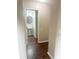 Small bathroom with pedestal sink and dark hardwood floors at 8781 Red Oak Dr, North Charleston, SC 29406