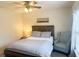 Charming bedroom with a full-size bed and window at 8781 Red Oak Dr, North Charleston, SC 29406