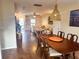 Open concept dining room and living room with hardwood floors at 8781 Red Oak Dr, North Charleston, SC 29406