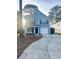 Two-story light blue house with a white garage door and front porch at 8781 Red Oak Dr, North Charleston, SC 29406