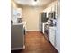 Kitchen with white cabinets, stainless steel appliances, and hardwood floors at 8781 Red Oak Dr, North Charleston, SC 29406