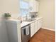 Kitchen with white cabinets, stainless steel appliances, and hardwood floors at 8781 Red Oak Dr, North Charleston, SC 29406